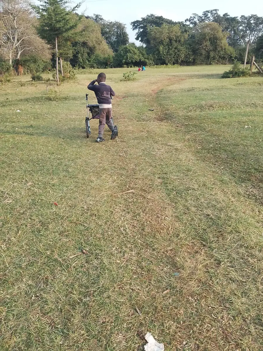 Pilot participant using the rollator on an outdoor path